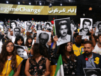 iran rally People hold pictures of relatives killed by the Mohllas regime, during 'Free Iran 2018 - the Alternative' event on June 30, 2018 in Villepinte, north of Paris during the Iranian resistance national council (CNRI) annual meeting. (Photo by Zakaria ABDELKAFI / AFP) (Photo credit should read ZAKARIA ABDELKAFI/AFP/Getty Images)