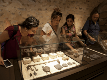 In this Wednesday, June 27, 2018 photo, visitors look at exhibits, entitled "The House of Herod: Life and Power in the Age of the New Testament," at the Terra Sancta Museum in Jerusalem. Jerusalem's Franciscan friars have opened The Terra Sancta Museum, a new museum in the old city of …