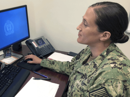 U.S. Navy Legalman First Class Tamatha Schulmerich works at her desk at the Naval War Coll