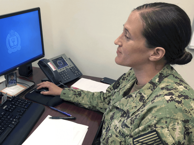 U.S. Navy Legalman First Class Tamatha Schulmerich works at her desk at the Naval War Coll