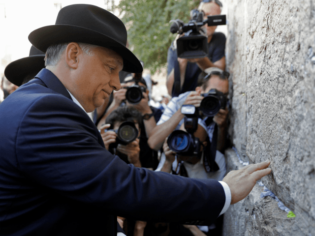 Hungarian Prime Minister Viktor Orban visits the Western Wall in Jerusalem's Old City on July 20, 2018. - The Hungarian Prime Minister pledged 'zero tolerance' for anti-Semitism on July 19, 2018, during a controversial visit to Israel after facing accusations of stoking anti-Jewish sentiment back home.Orban and Israeli Prime Minister …