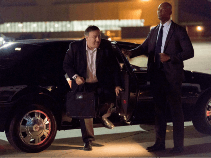 US Secretary of State Mike Pompeo (C) arrives to board his plane at Andrews Air Force Base