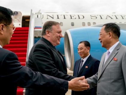 U.S. Secretary of State Mike Pompeo, second from left, is greeted by North Korean Director