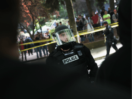Antifascist demonstrators confront police during a protest on June 4, 2017 in Portland, Oregon. A protest dubbed 'Trump Free Speech' by organizers was met by a large contingent of counter-demonstrators who viewed the protest as a promotion racism. Many residents of Portland are still coming to terms with the recent …