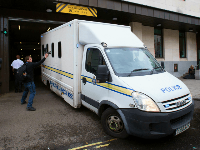 A prison van is driven out of Westminster Magistrates Court in central London on June 18,