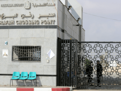Palestinian security forces loyal to the Palestinian Authority stand at the Rafah border c