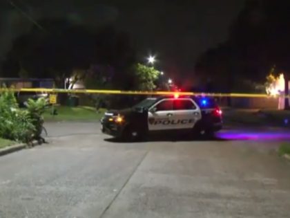Houston police say a home invasion suspect held a woman at gunpoint and was then shot in the head by the woman's husband.