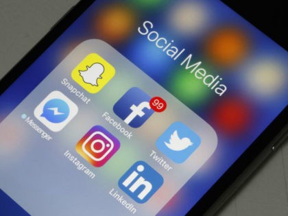 In this photo illustration, logos of the Snapchat, Facebook, Twitter, Messenger, Instagram and LinkedIn applications are displayed on the screen of an Apple iPhone on May 12, 2018 in Paris, France. Faced with the anger of dissatisfied users, the Snapchat application has canceled certain changes, announced at the end of …