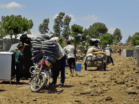 syrians his Thursday, July 5, 2018 photo provided by Nabaa Media, a Syrian opposition media outlet, shows people who fled from Daraa province, gathering in the Quneitra countryside, near the Israeli-occupied Golan Heights. Syrian state media and a war monitor said Friday that government forces have captured new areas along the …
