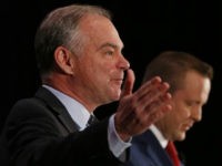 U.S. Sen. Tim Kaine, left, gestures as Republican challenger Corey Stewart, right, listens during the Virginia Bar Association debate at the Homestead in Hot Springs , Va., Saturday, July 21, 2018. (AP Photo/Steve Helber)