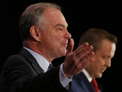 U.S. Sen. Tim Kaine, left, gestures as Republican challenger Corey Stewart, right, listens