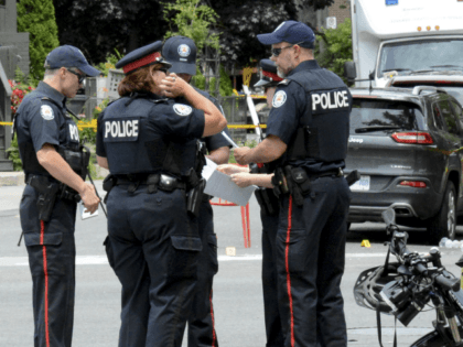 Toronto Police investigate the scene of a shooting the night before in Toronto, Ontario, Canada on July 23, 2018. - Toronto police were seeking to determine a motive on after a 29-year-old man opened fire with a handgun on restaurant goers and pedestrians in a busy neighborhood of Canada's largest …