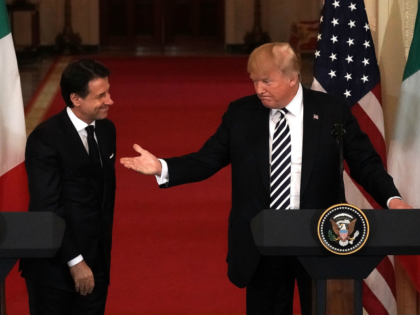U.S. President Donald Trump (R) and Italian Prime Minister Giuseppe Conte (L) participate in a joint news conference at the East Room of the White House July 30, 2018 in Washington, DC. President Trump held bilateral talks with Prime Minister Conte in the Oval Office earlier. (Photo by Alex Wong/Getty …