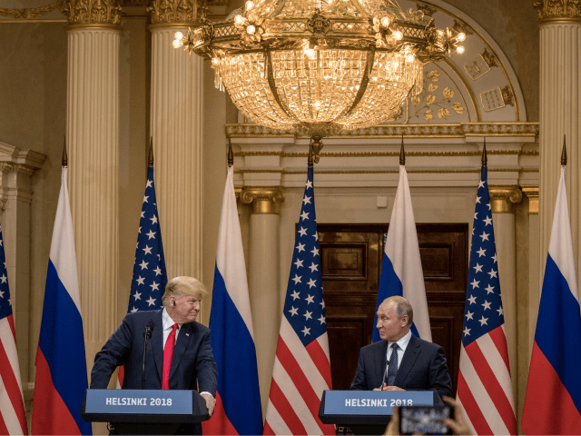 U.S. President Donald Trump (L) and Russian President Vladimir Putin speak to the media du