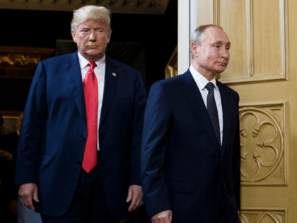 US President Donald Trump (L) and Russian President Vladimir Putin arrive for a meeting in Helsinki, on July 16, 2018. (Photo by Brendan Smialowski / AFP) (Photo credit should read BRENDAN SMIALOWSKI/AFP/Getty Images)