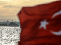 turkey A Turkish flag flies on a ferry as Russian warship the BSF Saratov 150 sails through the Bosphorus off Istanbul en route to the eastern Mediterranean sea on September 26, 2015. AFP PHOTO/OZAN KOSE (Photo credit should read OZAN KOSE/AFP/Getty Images)