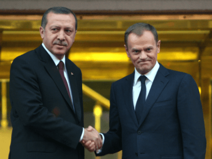Poland's Prime Minister Donald Tusk, right, and his Turkish counterpart Recep Tayyip Erdogan pose for cameras before their meeting in Ankara, Turkey, Wednesday, Dec. 8, 2010. Tusk is in Turkey for a two-day official visit.(AP Photo/Burhan Ozbilici)