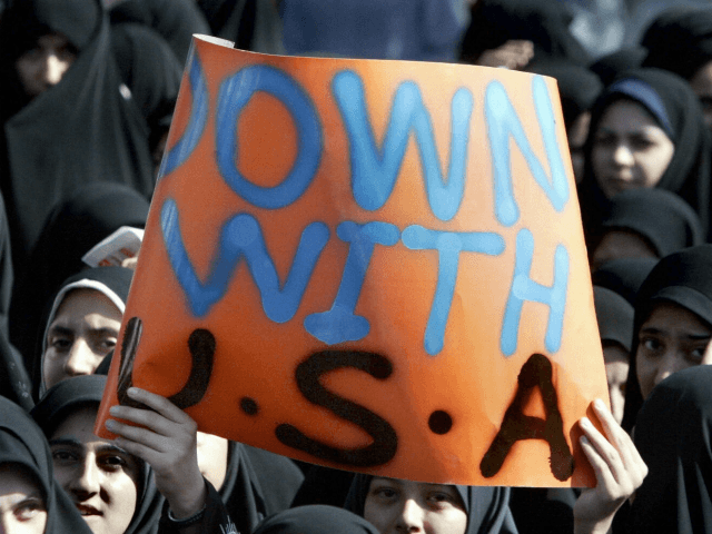 Iran Islamist hardliner women hold anti-US slogans outside the British embassy in Tehran,