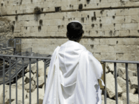 western wall Observing Jew looks at the part f the Western Wall where one of the stones dislodged and crashed into the prayer area in Jerusalem Monday, July 23, 2018. The Western Wall, a retaining wall of the compound where the biblical Jewish temples once stood, is the holiest site where Jews …