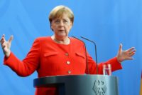 Merkel says any negotiations on lowering car tariffs can only be conducted internationally -- not just with the US