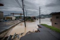 The Japan disaster has left entire villages submerged by flooding and left just the top of traffic lights visible above the rising waters