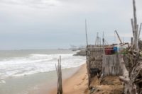 In the beachfront village of Agebkope on Togo's shore, houses have been swept into the sea and others teeter on the brink as coastal erosion worsens