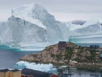 Greenland authorities have urged residents of the Innarsuit island settlement to move away from the coast over fears that the iceberg could swamp the area if it breaks up Greenland authorities have urged residents of the Innarsuit island settlement to move away from the coast over fears that the iceberg could swamp the area if it breaks up