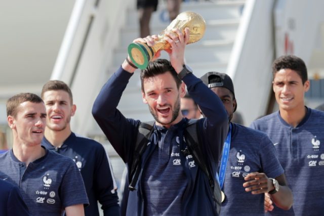 Crowds pack Champs Elysees as French World Cup winners return home