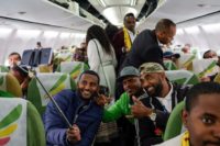 Passengers pose for a selfie aboard the Ethiopian Airlines plane -- the first flight from Addis Ababa to Eritrea in a generation