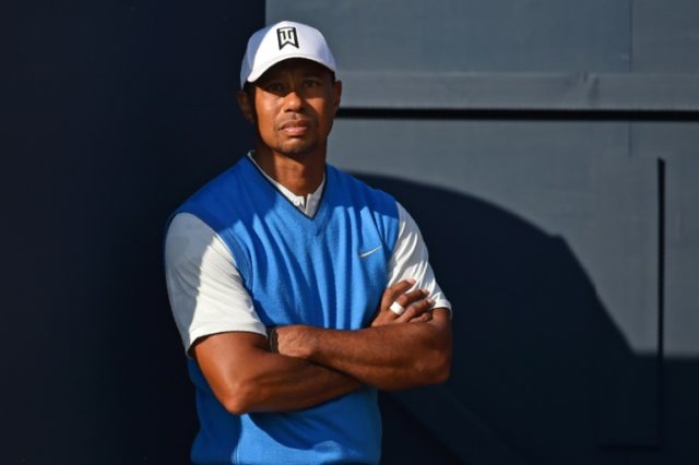 Woods finds his Open return a pain in the neck