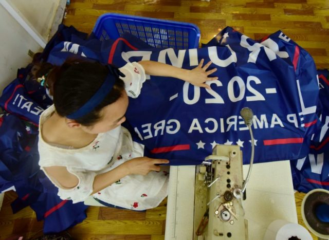 As trade war rages, Trump flags fly out of China factory