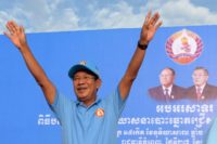 Cambodia's Prime Minister Hun Sen, waving at supporters during a campaign rally, faces no credible electoral opposition in what has become a virtual one-party state