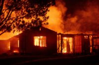 A house burns during the "Carr fire" in Redding, California, which has killed two firefighters and destroyed 65 structures A house burns during the "Carr fire" in Redding, California, which has killed two firefighters and destroyed 65 structures