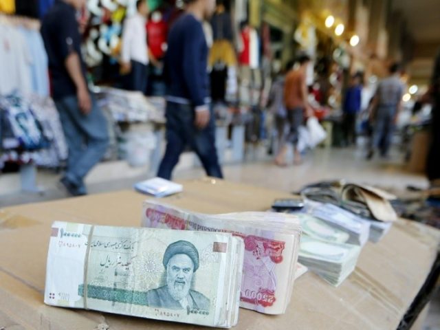 23ae35_iranian-rial-has-lost-two-thirds-its-start-year-iran-currency-drops-18-in-e1533129706922-640x480.jpg