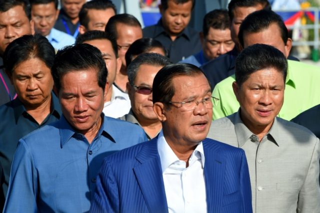 Cambodia's strongman leader Hun Sen (C) has hailed the election as 'free, fair and just' One-party rule 'terrible setback' for Cambodia: opposition chief