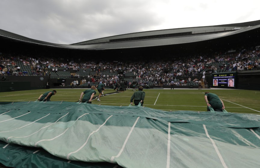 The Latest Play halted by rain at Wimbledon Breitbart