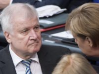 Germany Migrants Germany Interior Minister Horst Seehofer, left, talks to German Chancellor Angela Merkel during a debate of the German parliament Bundestag in Berlin, Thursday, July 5, 2018. (Bernd von Jutrczenka/dpa via AP) The Latest: Italy wants crackdown on humanitarian protection