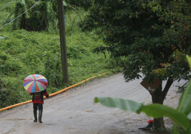 Thailand Cave Search A rescuer moves to the entrance to a cave complex where five still were trapped in Mae Sai, Chiang Rai province, northern Thailand Tuesday, July 10, 2018. The eight boys were rescued from the flooded cave. (AP Photo/Sakchai Lalit) The Associated Press