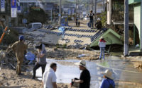 The Latest: 134 confirmed dead as Japan searches for missing