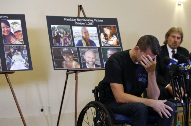Las Vegas Shooting Jason McMillan, 36, of Riverside, a Riverside County Sheriff's deputy who was shot and paralyzed in the Oct, 1, 2017, Las Vegas shooting, reacts as he talks about that evening and is upset MGM's decision, during a personal account brought together by attorneys at a news conference in Newport Beach, Calif., Monday, July 23, 2018. Behind McMillan are images of the shooting victims of the October 1, 2017 shooting. Victims of the fatal mass shooting at a Las Vegas country music festival are outraged they are being sued by MGM, which owns the hotel where the gunman opened fire. (AP Photo/Alex Gallardo) The Associated Press