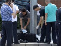 China US Embassy Explosion Chinese officials work near the site of a reported blast just south of the U.S. Embassy in Beijing, Thursday, July 26, 2018. (AP Photo/Mark Schiefelbein) Chinese officials work near the site of a reported blast just south of the U.S. Embassy in Beijing, Thursday, July 26, 2018. (AP Photo/Mark Schiefelbein)