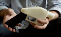 3D Guns In this May 10, 2013, file photo, Cody Wilson holds what he calls a Liberator pistol that was completely made on a 3 D printer at his home in Austin, Texas. Eight states filed suit Monday, July 30, 2018, against the Trump administration over its decision to allow a Texas company to publish downloadable blueprints for a 3D printed gun, contending the hard to trace plastic weapons are a boon to terrorists and criminals and threaten public safety. (Jay Janner/Austin American Statesman via AP, File) The Associated Press