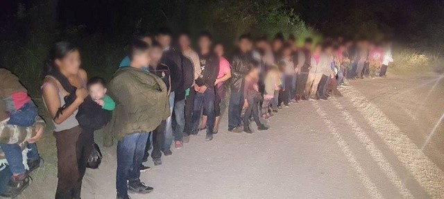 Weslaco Station agents arrest a group of 59 illegal aliens who had just been smuggled across the border from Mexico. (Photo: U.S. Border Patrol/Rio Grande Valley Sector)