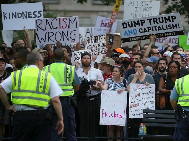 WASHINGTON, DC - AUGUST 12: Counter-protest groups gather near a white supremacists, neo-Nazis, members of the Ku Klux Klan and other hate groups gathering for the Unite the Right rally in Lafayette Park across from the White House August 12, 2018 in Washington, DC. Thousands of protesters are expected to …