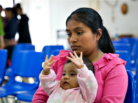 A Guatemalan woman and her infant daughter seeking asylum sit at a Catholic Charities relief center on Sunday, June 17, 2018, A Guatemalan woman and her infant daughter seeking asylum sit at a Catholic Charities relief center on Sunday, June 17, 2018,