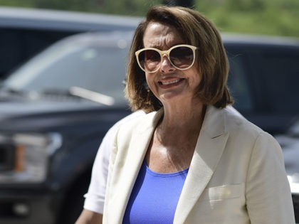 House Democratic Leader Nancy Pelosi arrives at a joint press conference with members of a