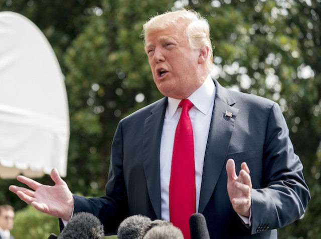 President Donald Trump speaks to members of the media before boarding Marine One on the South Lawn at the White House in Washington, Friday, Aug. 17, 2018, for a short trip to Andrews Air Force Base, Md., and then on to Southampton, N.Y., for a fundraiser. (AP Photo/Andrew Harnik)