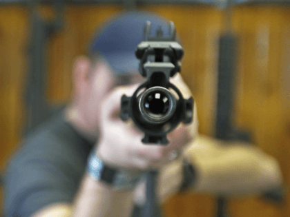 Dordon Brack, aims a semi-automatic AR-15 that is for sale at Good Guys Guns & Range on Fe