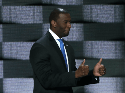 Tallahassee Mayor Andrew Gillum (D-FL) gives two thumbs up as he walks on stage to deliver
