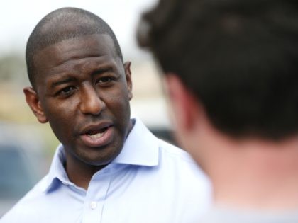 Democratic gubernatorial candidate Andrew Gillum chats with students during a voter regist